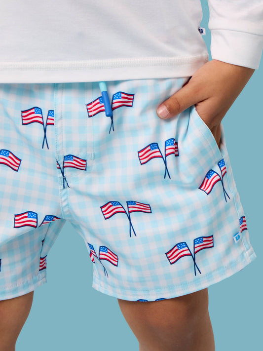 RuffleButts + RuggedButts - Boys Blue Patriotic Gingham Performance Hybrid Swim Trunks