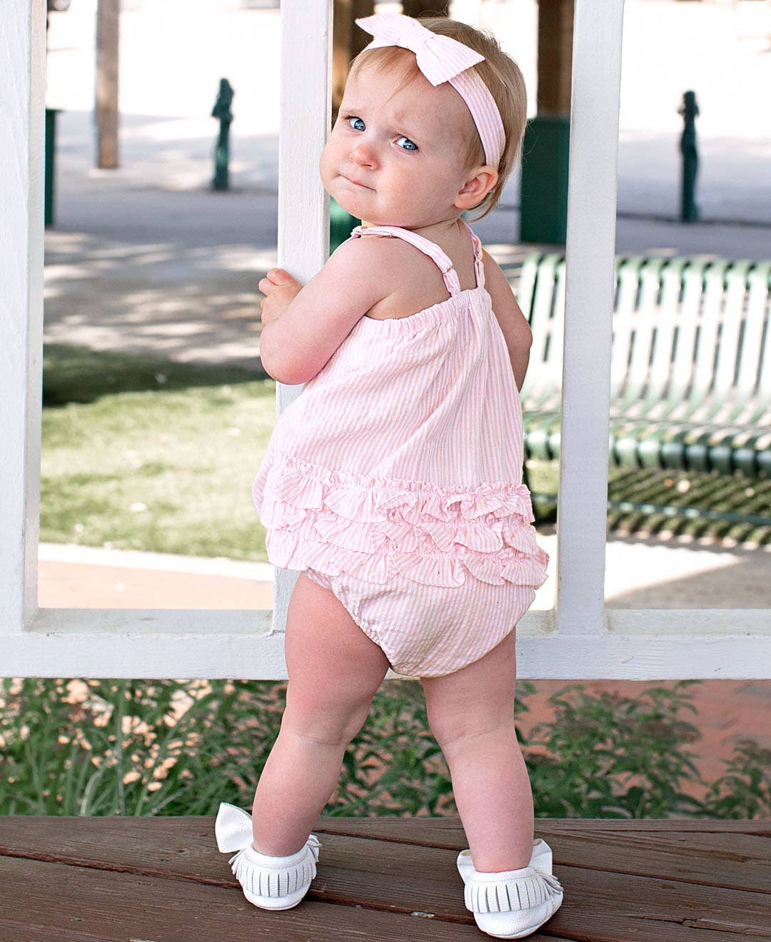 RuffleButts + RuggedButts - Baby Girls Pink Seersucker Bow Front Bubble Woven Romper