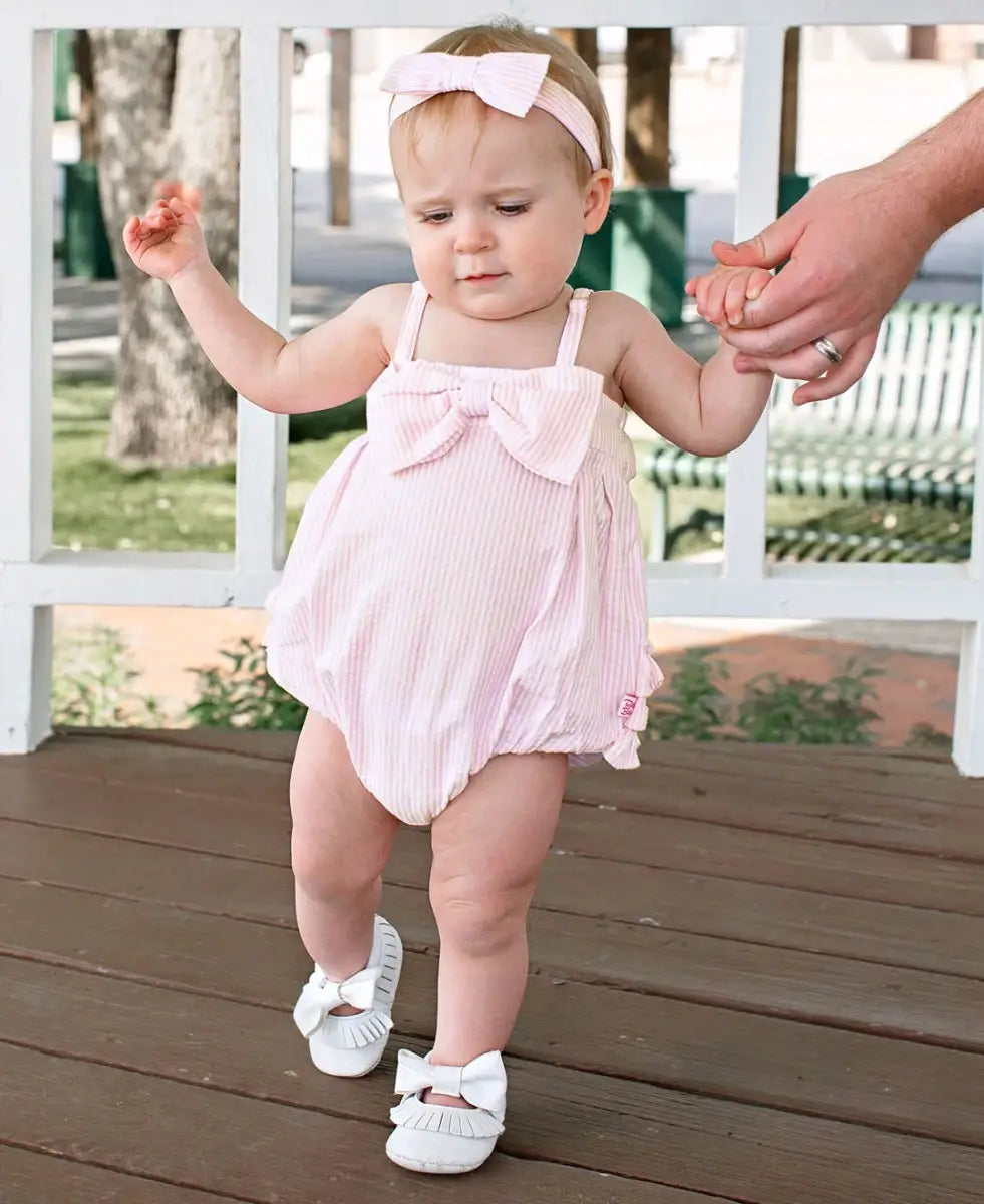 RuffleButts + RuggedButts - Baby Girls Pink Seersucker Bow Front Bubble Woven Romper