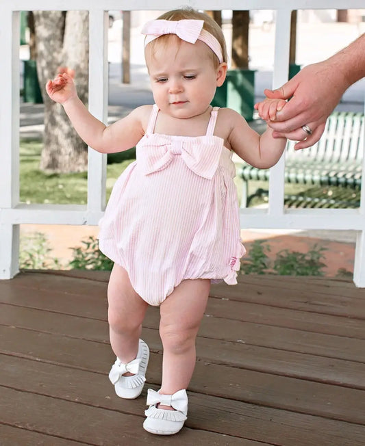 RuffleButts + RuggedButts - Baby Girls Pink Seersucker Bow Front Bubble Woven Romper