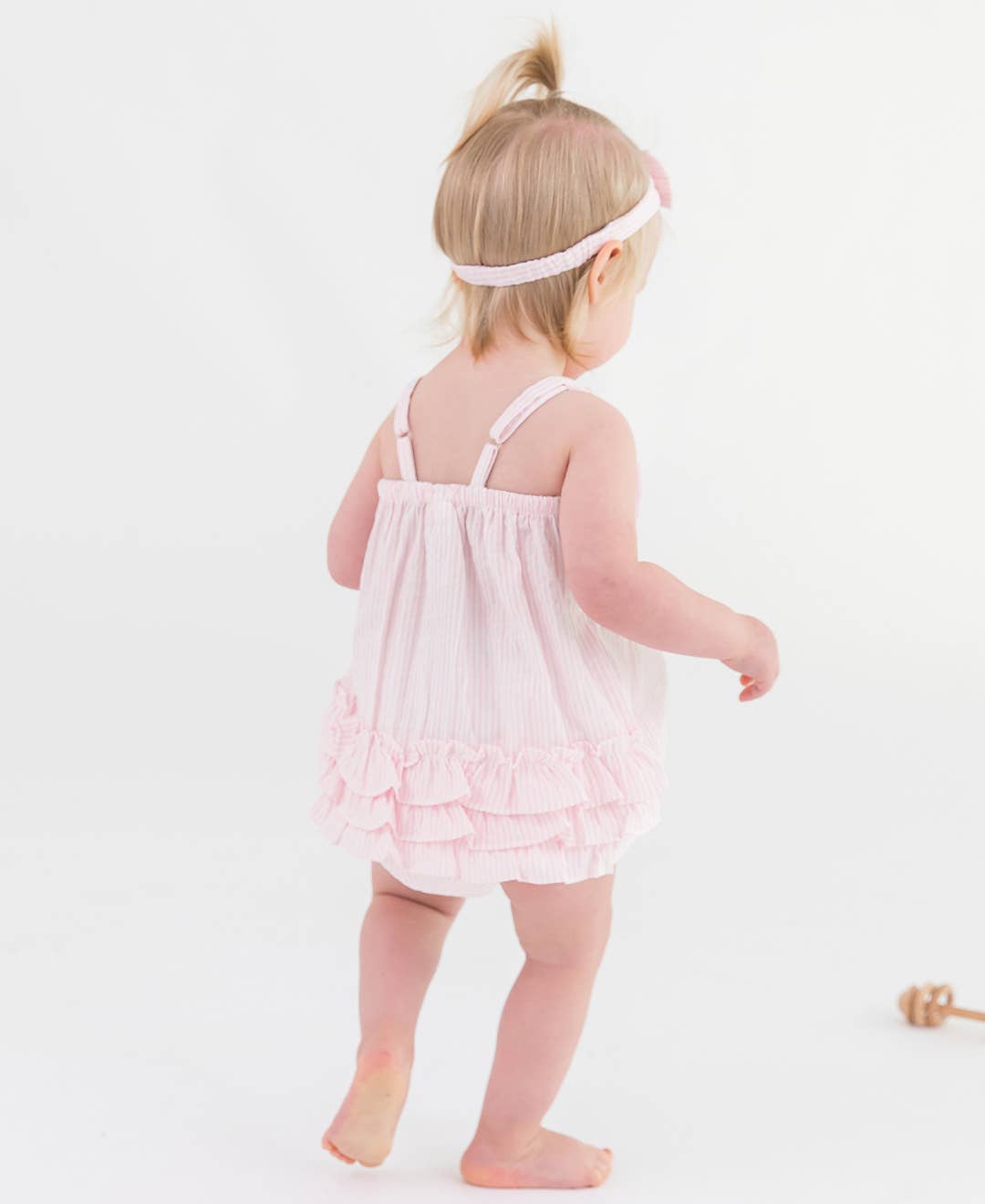 RuffleButts + RuggedButts - Baby Girls Pink Seersucker Bow Front Bubble Woven Romper